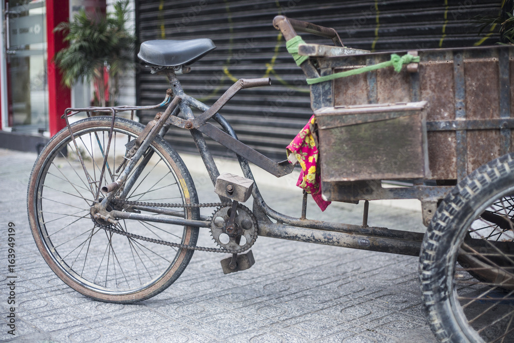 Antique old cargo bicycles, cargo tricycles.