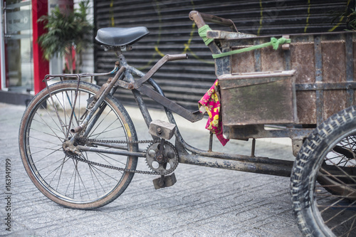 Antique old cargo bicycles, cargo tricycles.