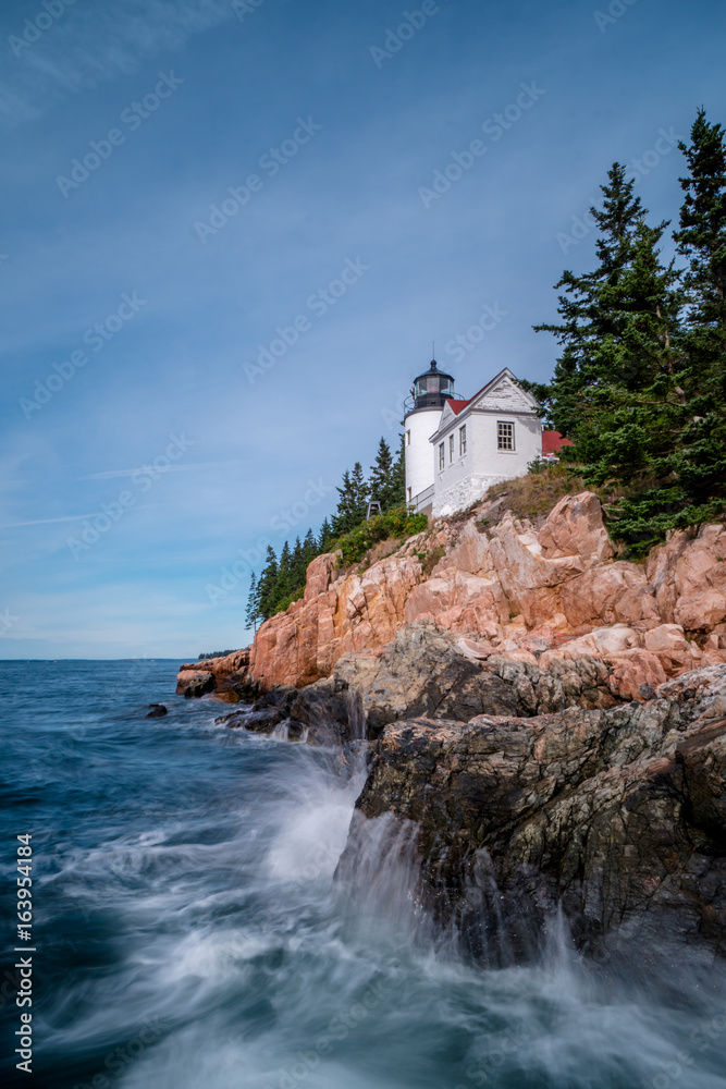 beautiful white lighthouse on a rocky promontory on the coast of northern Maine near Acadia National Park and Bar Harbor beautiful white lighthouse on a rocky promontory on the coast of northern Maine near Acadia National Park and Bar Harbor