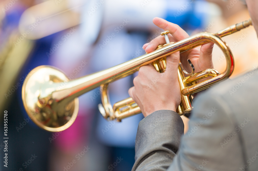 Obraz premium Closeup of trumpet player's hands at Jazz Festival