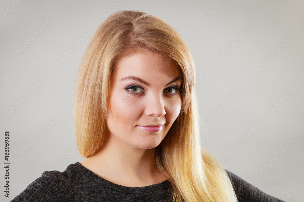 Portrait of happy blonde woman smiling with joy Portrait of happy blonde woman smiling with joy