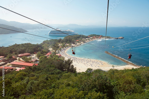 People doing zip line in caribbean coast