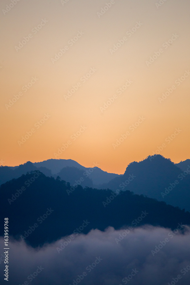 Silhouette layers of mountains in the morning.