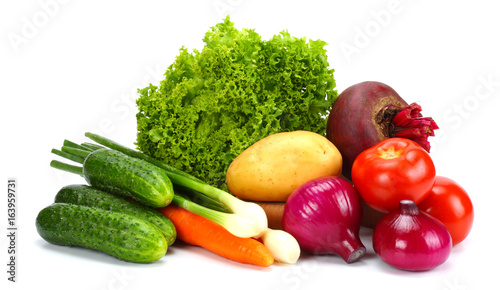 Assortment of fresh raw vegetables isolated on white background. Tomato, cucumber, onion, salad, carrot, beetroot, potato