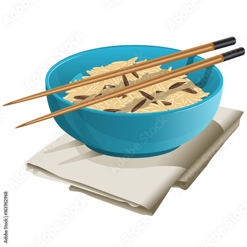 Ceramic bowl with rice in it / Ceramic bowl stands on the gray napkin. There is a rice in the bowl and on the bowl lay brown Chinese chopsticks