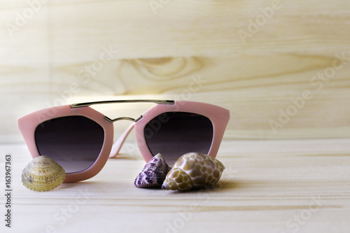 sunglasses on wood background, holidays on sunnyworld