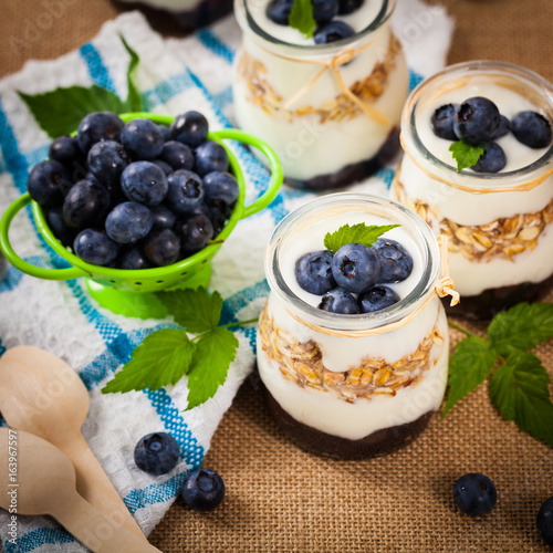 Healthy Greek Yogurt with Blueberries and Granola Parfait. Selective focus.