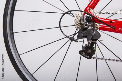 Mechanism. Bicycle Concept. Part of the rear wheel, gear, chain. On a white background.