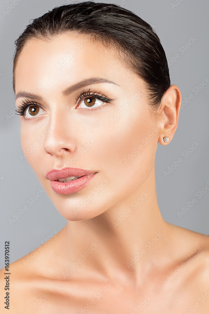 Beautiful Face of Young Woman with Clean Fresh Skin Beautiful Face of Young Woman with Clean Fresh Skin