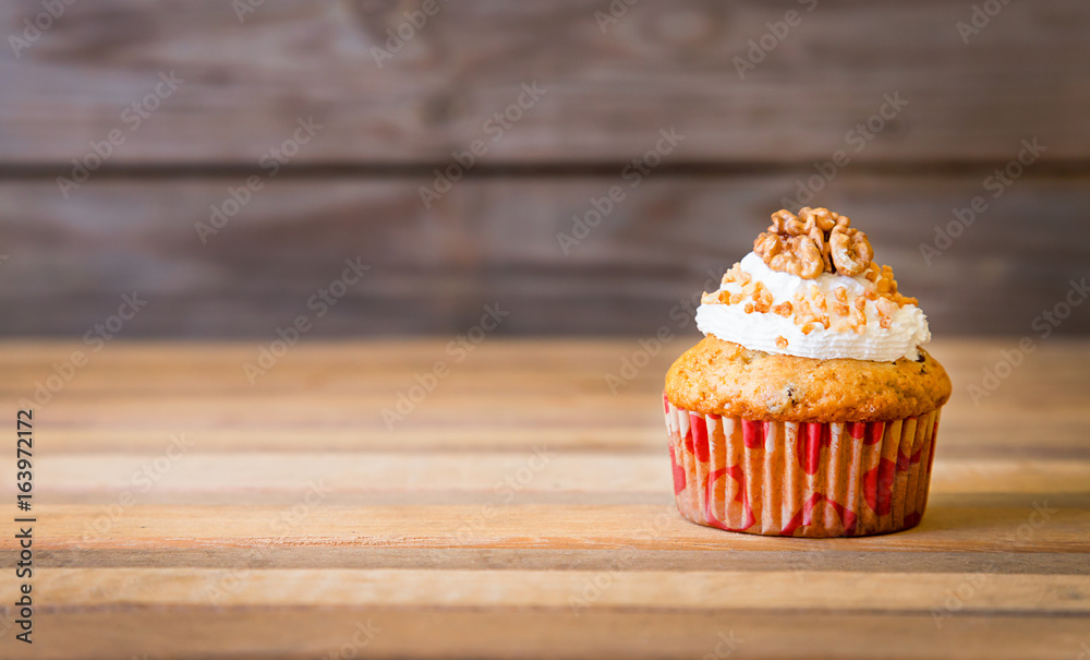 Foamy cupcake on wooden table Foamy cupcake on wooden table