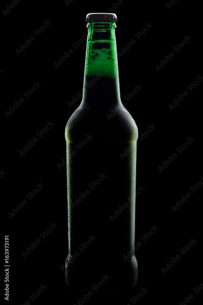 green bottle of beer, clipping path,on a black background, with brilliant edges and foam green bottle of beer, clipping path,on a black background, with brilliant edges and foam