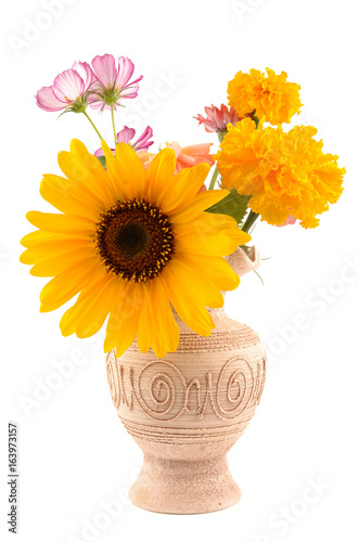 sunflower and wild flowers in a vase
