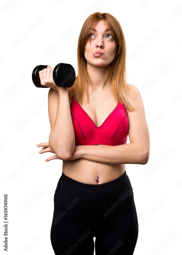 Beautiful sport woman with dumbbells thinking Beautiful sport woman with dumbbells thinking