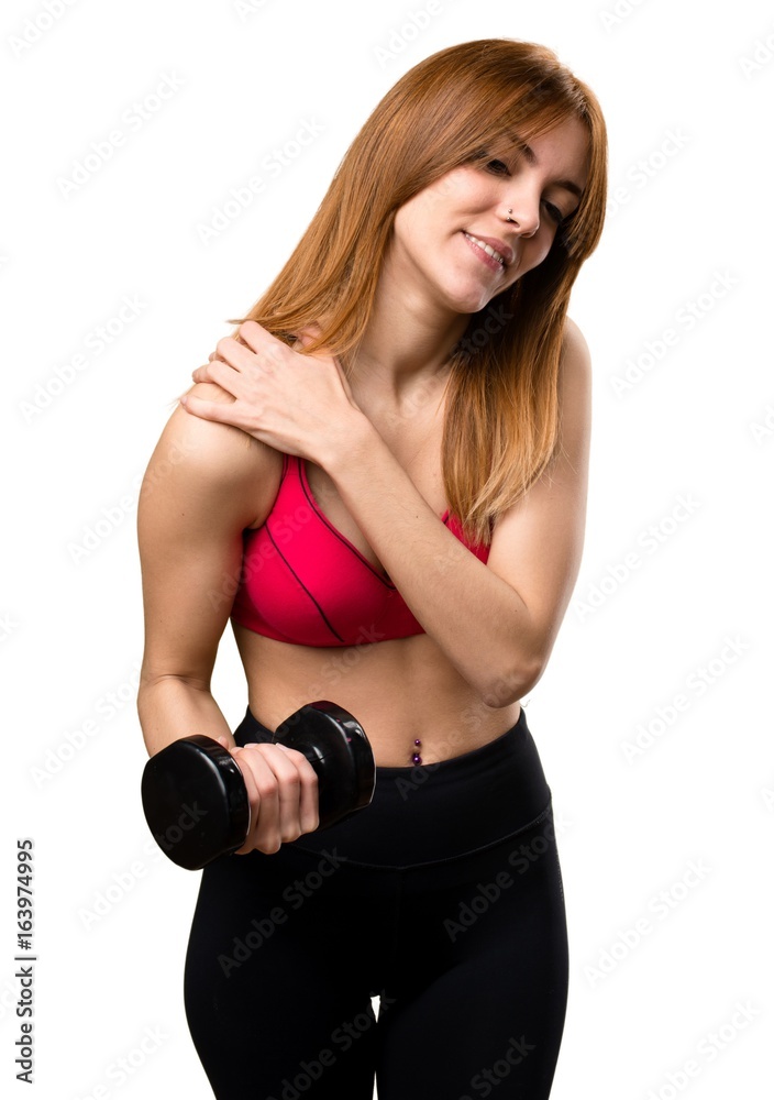 Beautiful sport woman with dumbbells with shoulder pain Beautiful sport woman with dumbbells with shoulder pain