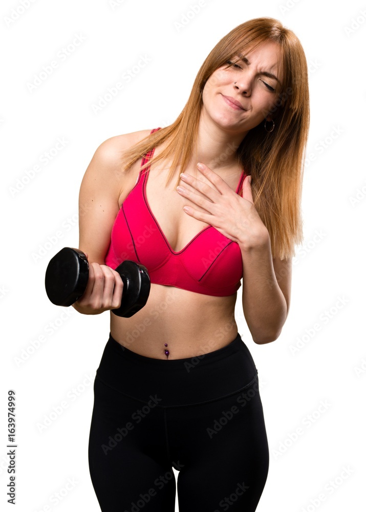 Beautiful sport woman with dumbbells with heart pain Beautiful sport woman with dumbbells with heart pain