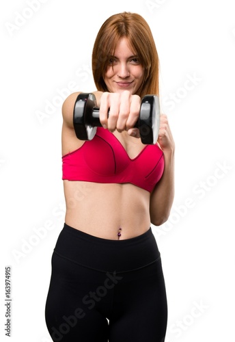 Beautiful sport woman with dumbbells