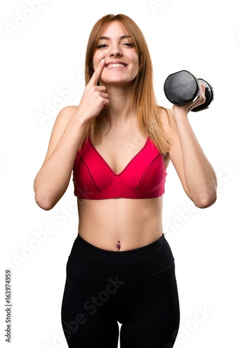 Happy beautiful sport woman with dumbbells