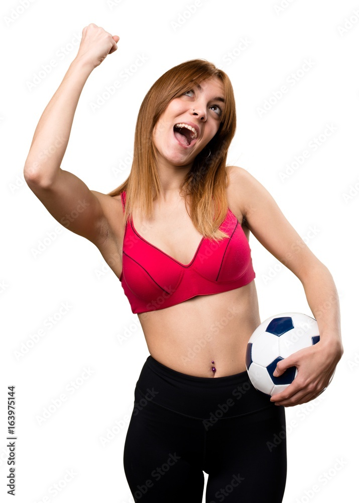 Young sport woman holding a soccer ball Young sport woman holding a soccer ball