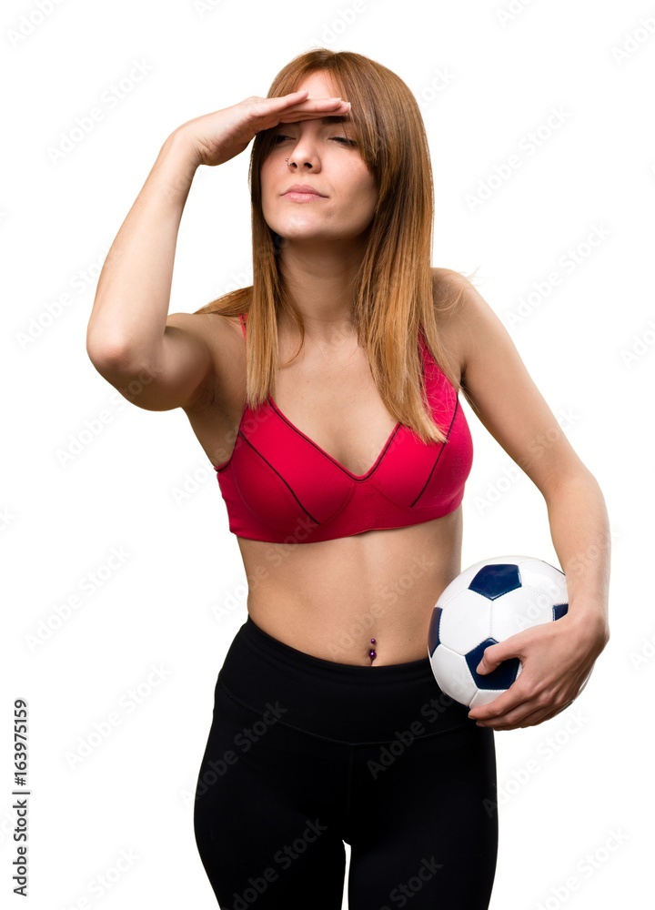 Young sport woman holding a soccer ball Young sport woman holding a soccer ball