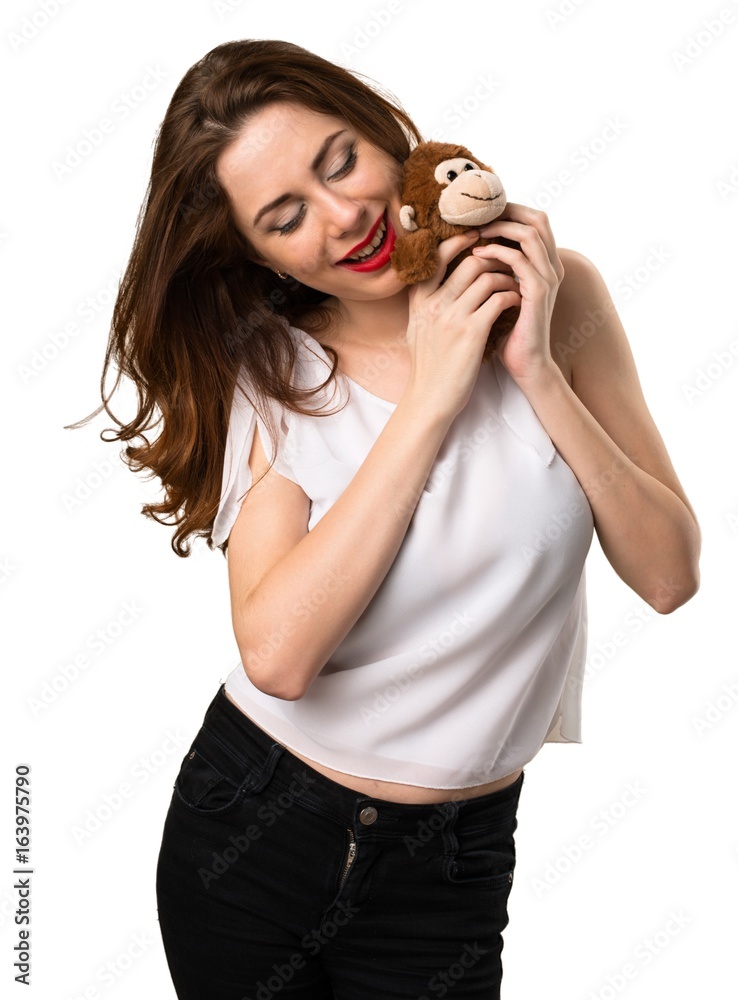 Beautiful young girl playing with a little stuffed animal Beautiful young girl playing with a little stuffed animal