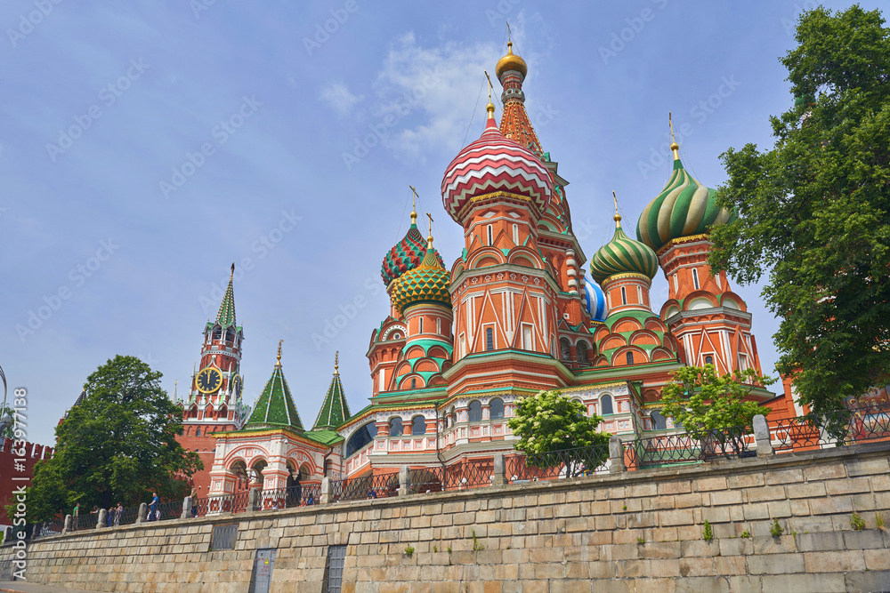 View on Moscow Red Square, Kremlin towers, stars and Clock Kuranti, Saint Basil's Cathedral church. Moscow Red Square Saint Basil's Cathedral church. Moscow vacation tours famous sightseeing points
