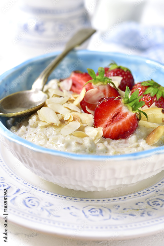 Oat porridge with fresh strawberry for a breakfast. Oat porridge with fresh strawberry for a breakfast.