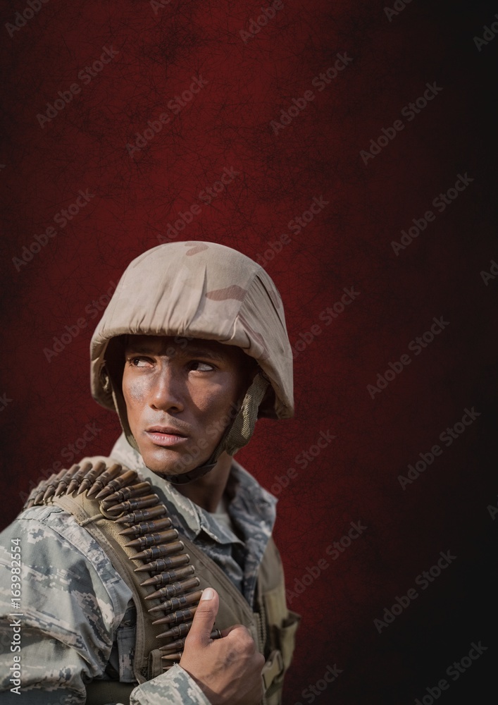 Soldier man standing against red background Soldier man standing against red background