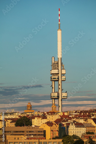 View from the Powder Tower on the Prague landscape on a sunny day with the famous Zizkov TV tower on the horizon © murmakova