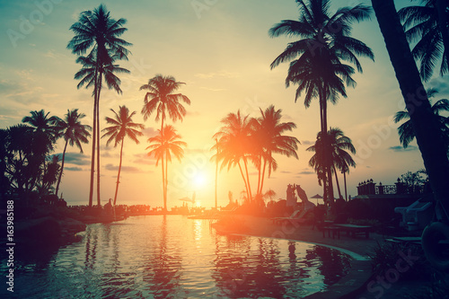 Amazing sunset at a beach resort in the tropics. © De Visu