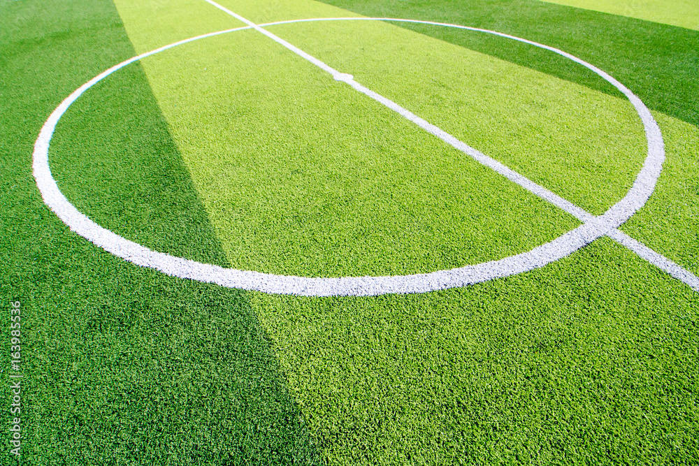 Obraz premium The white Line marking on the artificial green grass soccer field