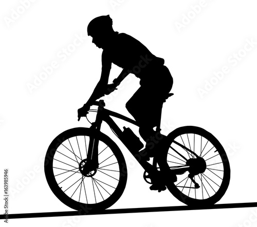 Side profile silhouette of male mountain bike racer