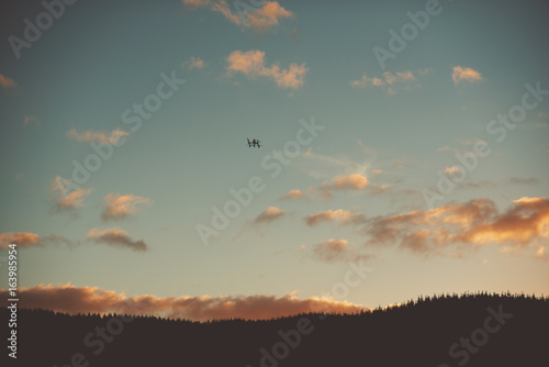 dji inspire drone flying into sunset © Nick Gee