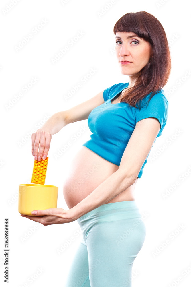 Woman in pregnant throwing medical pills or capsules, reduction of using tablets in pregnancy Woman in pregnant throwing medical pills or capsules, reduction of using tablets in pregnancy