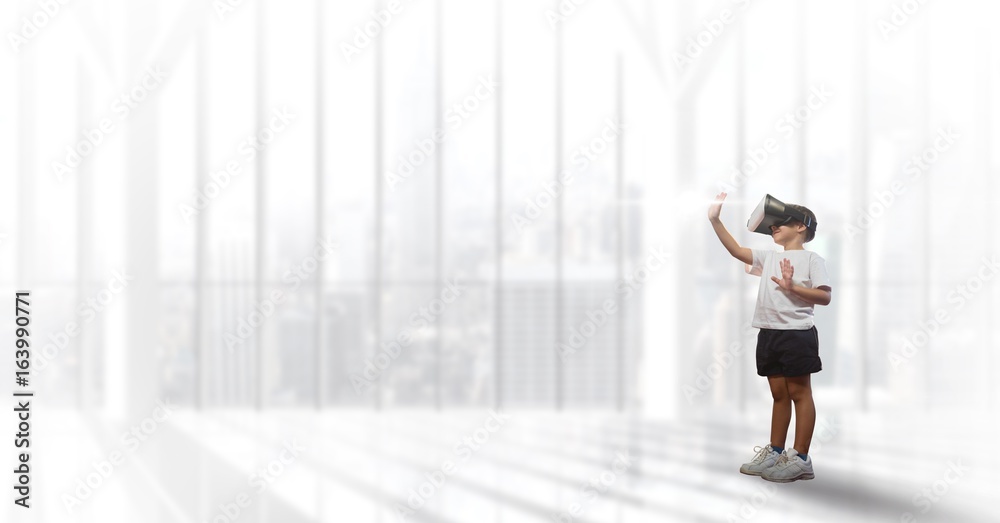 Fototapeta premium Boy in VR headset touching flare against white background