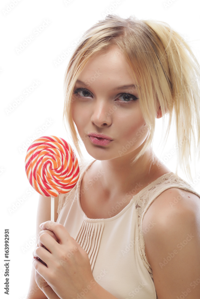 Young blond woman with candy
