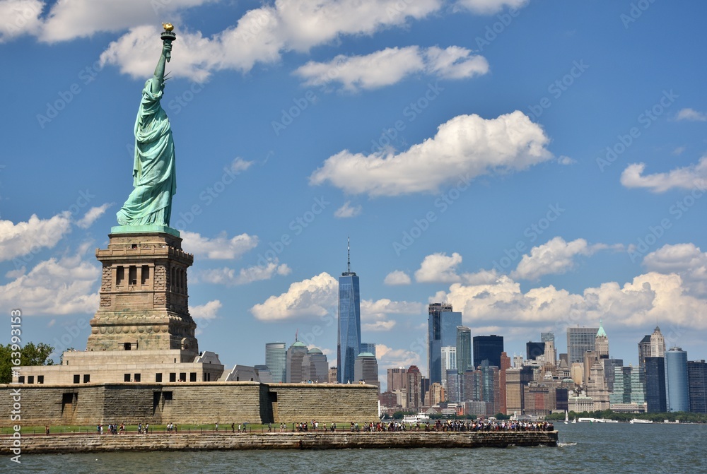 The Statue of Liberty and skyline of New York City. 