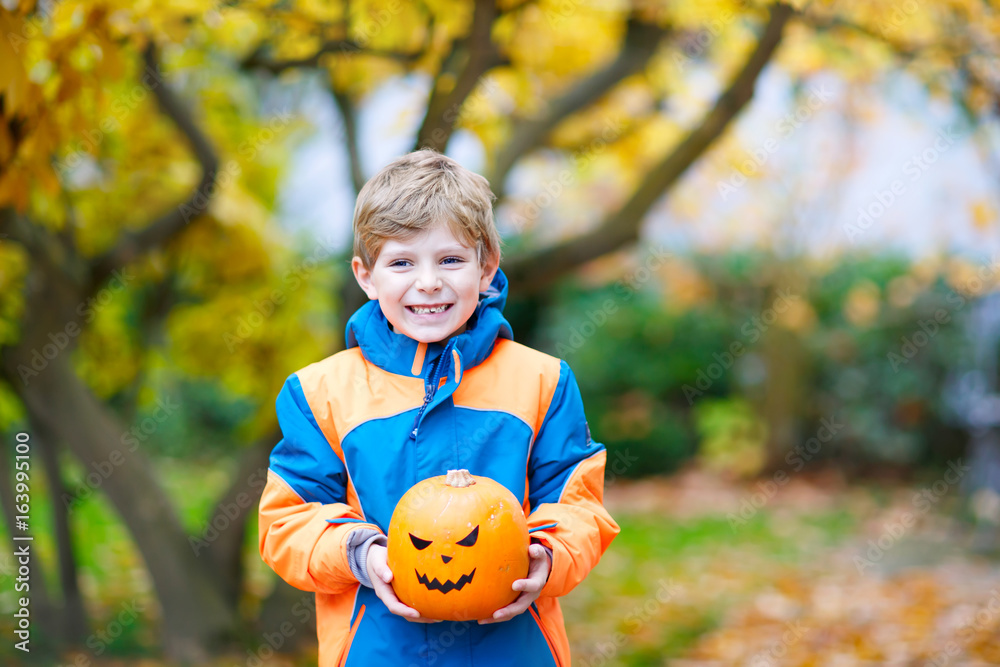happy cute little kid boy with halloween pumpkin lantern on autumn happy cute little kid boy with halloween pumpkin lantern on autumn