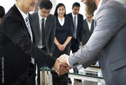 Business Partners Introductionary Handshake Bow photo