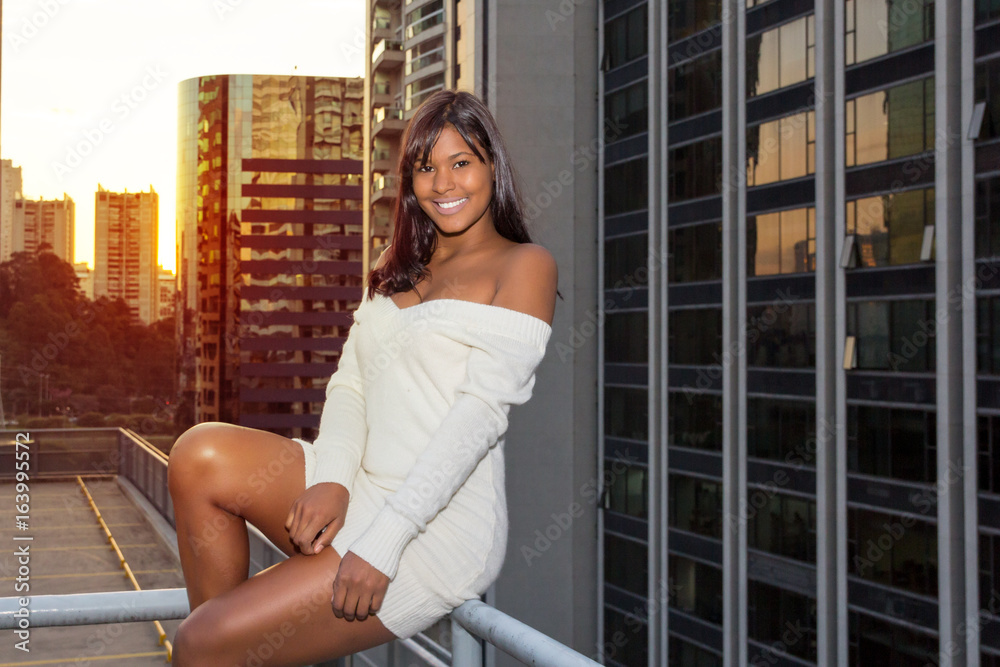 Beautiful teenage girl looks at the camera and smiles, poses for the camera. Beautiful teenage girl looks at the camera and smiles, poses for the camera.