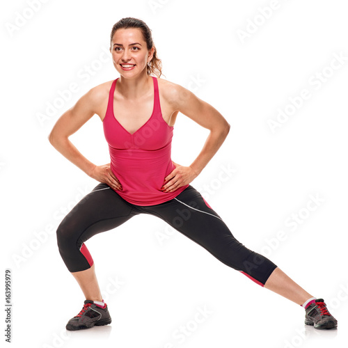 Smiling fitness woman warming-up