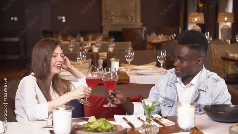 Young couple on date in restaurant Young couple on date in restaurant