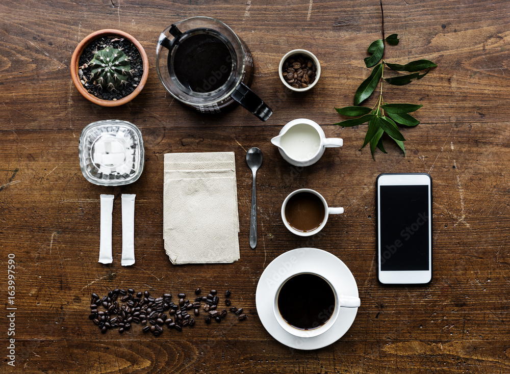 Aerial view of coffee setting on wooden table Aerial view of coffee setting on wooden table