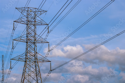 Close up view of high voltage tower with cables