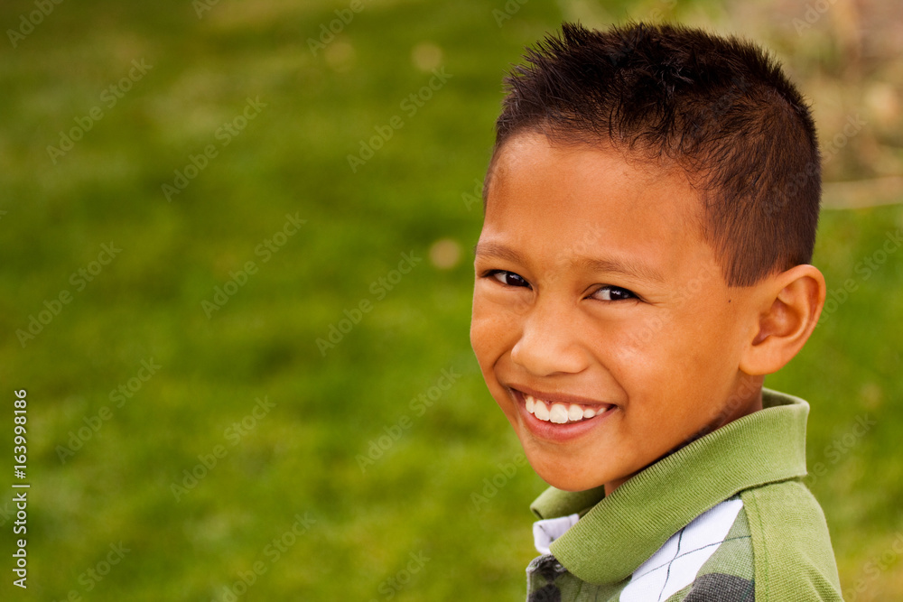 Happy young Asian kid smiling and laughing. Happy young Asian kid smiling and laughing.