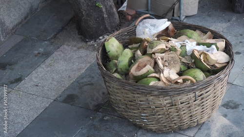 Mouse run to eat in basket with coconut waste. photo