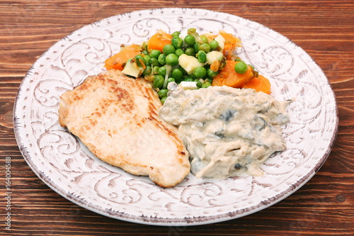 Turkey fillet with mushrooms in cream sauce and vegetables