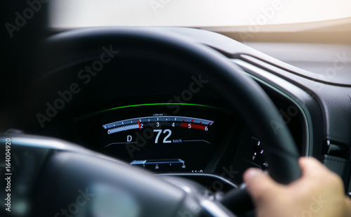 Modern car illuminated dashboard closeup © Em7
