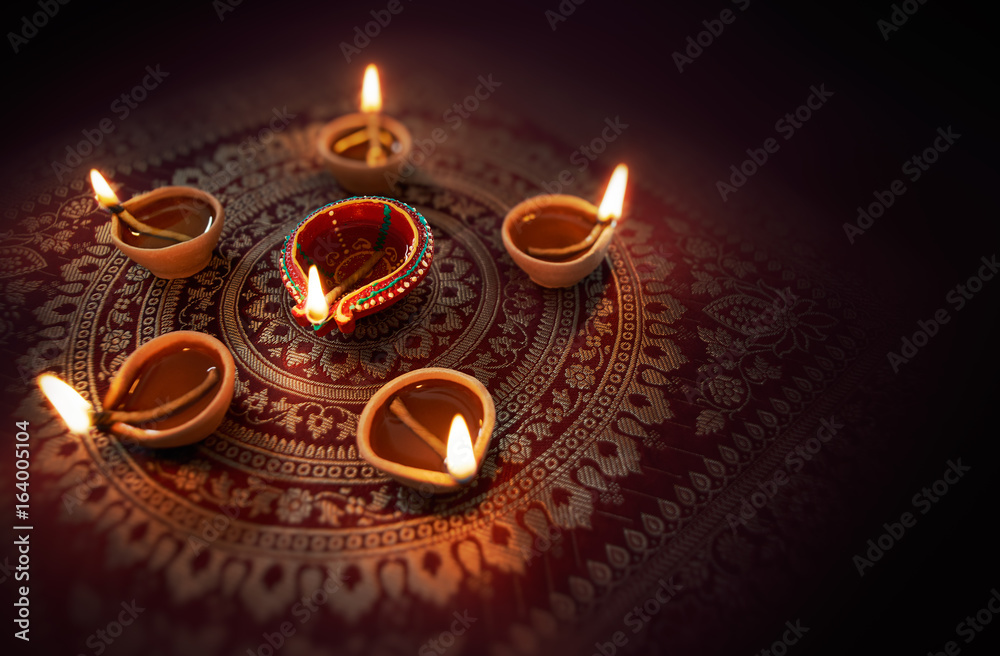 Naklejka premium Diya lamps lit during diwali celebration
