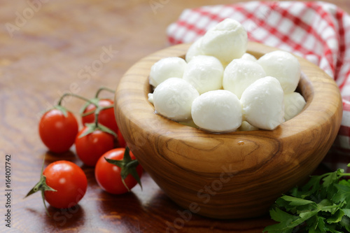 Italian soft mozzarella cheese on a wooden table