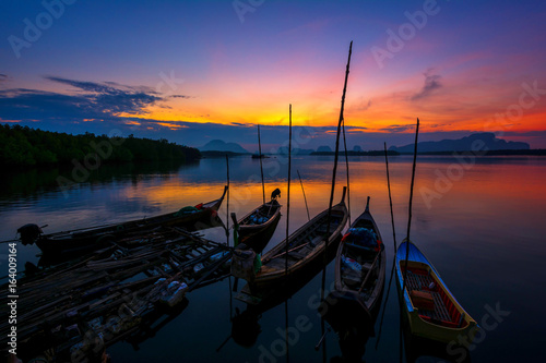 Fishing boats with morning sun on the sea.The sunset is beautiful.In Thailand.